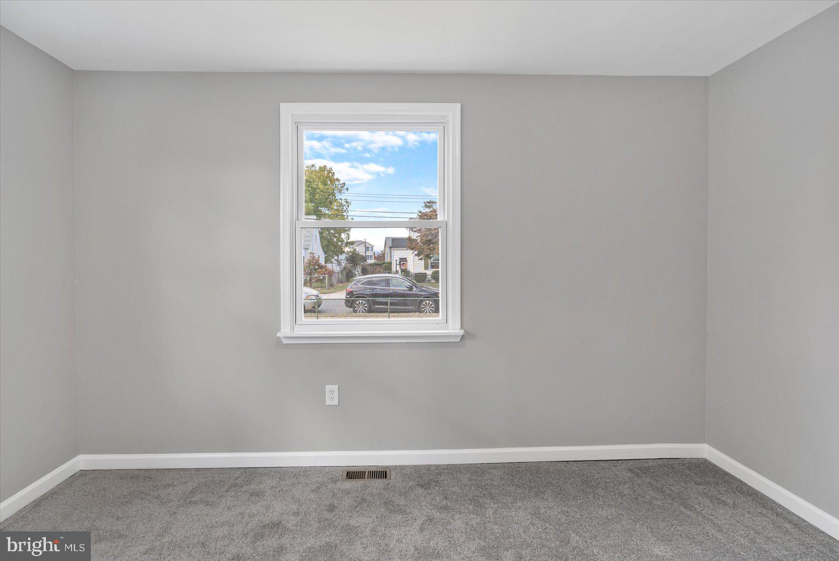8217 Bullneck Road Baltimore, MD 21222 - Photo 33 of 41 a view of an empty room with a window
