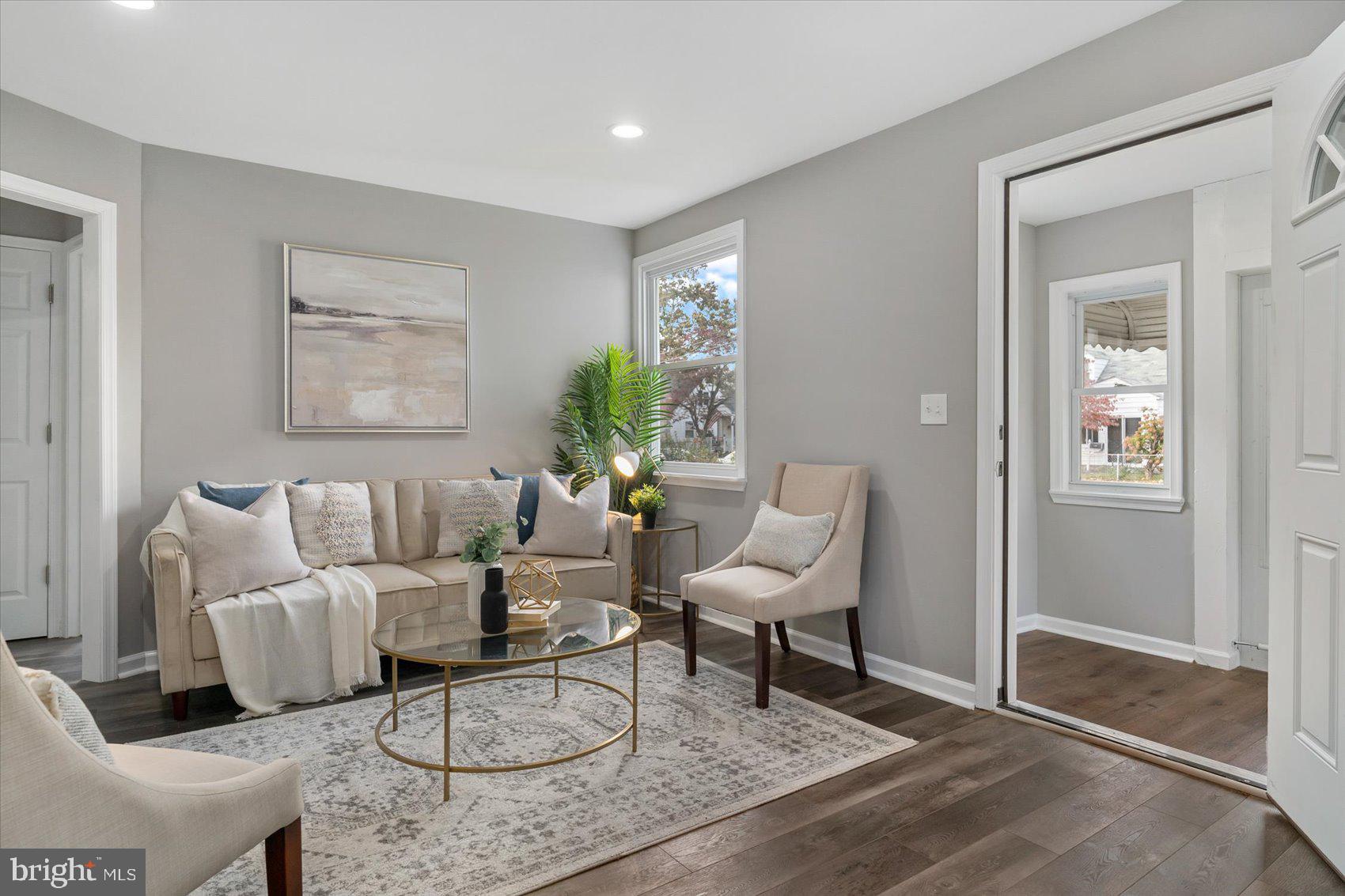 8217 Bullneck Road Baltimore, MD 21222 - Photo 5 of 41 a living room with furniture a rug and a table
