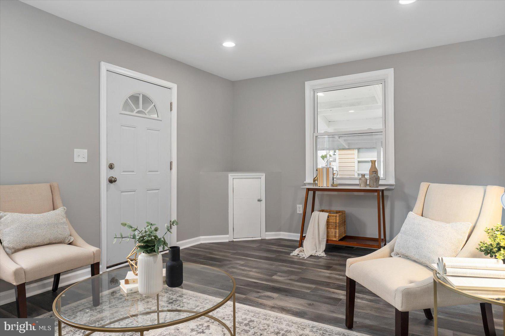 8217 Bullneck Road Baltimore, MD 21222 - Photo 6 of 41 a living room with furniture and a potted plant