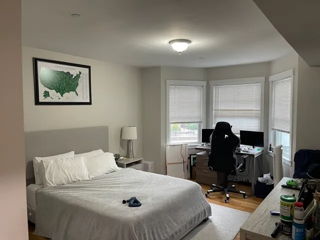 a room with a bed and furniture