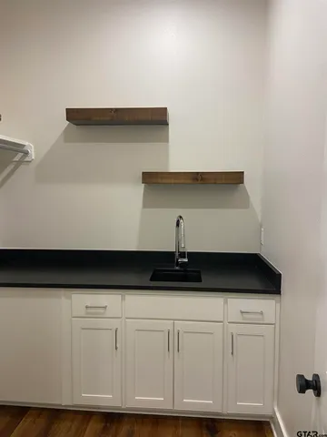 a kitchen with white cabinets