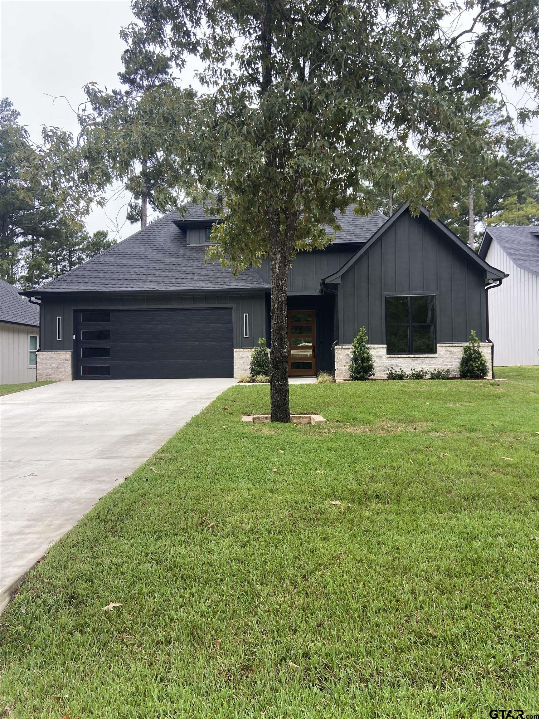 18690 Windjammer Place Flint, TX 75762 - Photo 3 of 47 a house view with a garden space