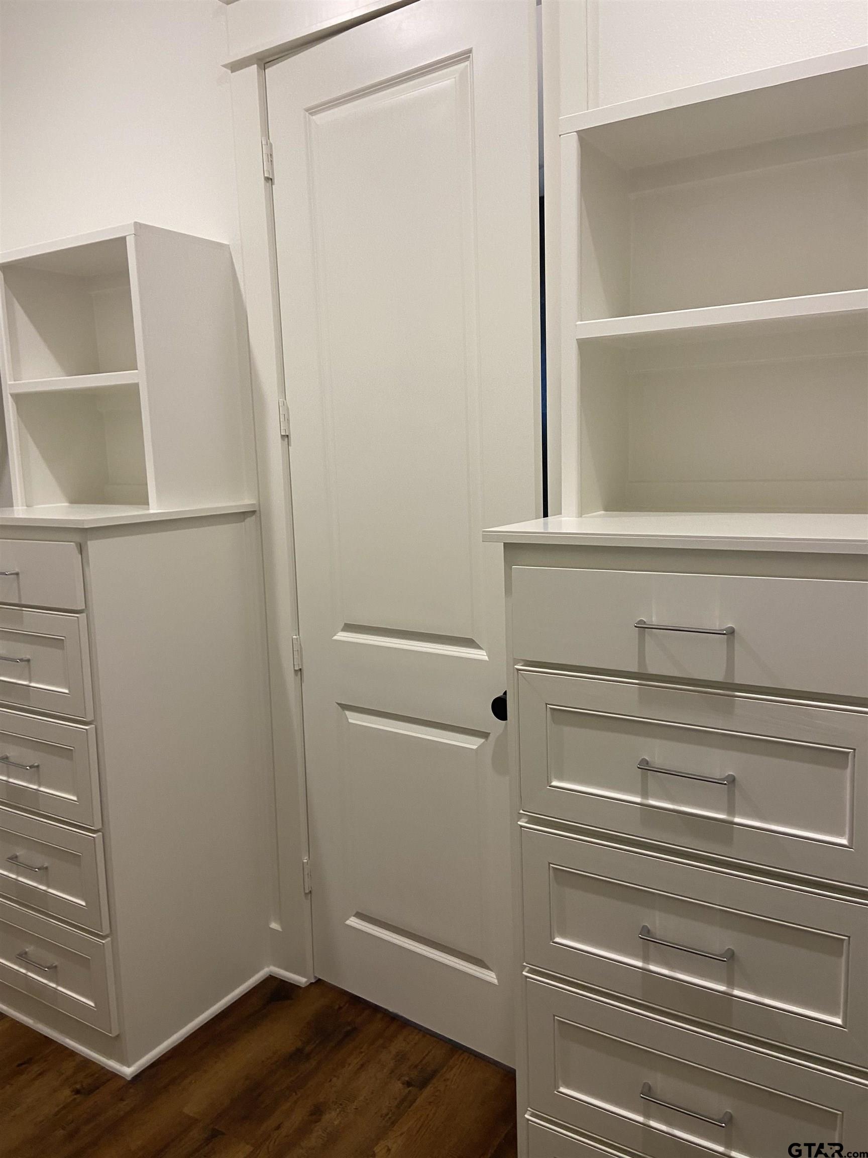 18690 Windjammer Place Flint, TX 75762 - Photo 34 of 47 a view of walk in closet with empty racks