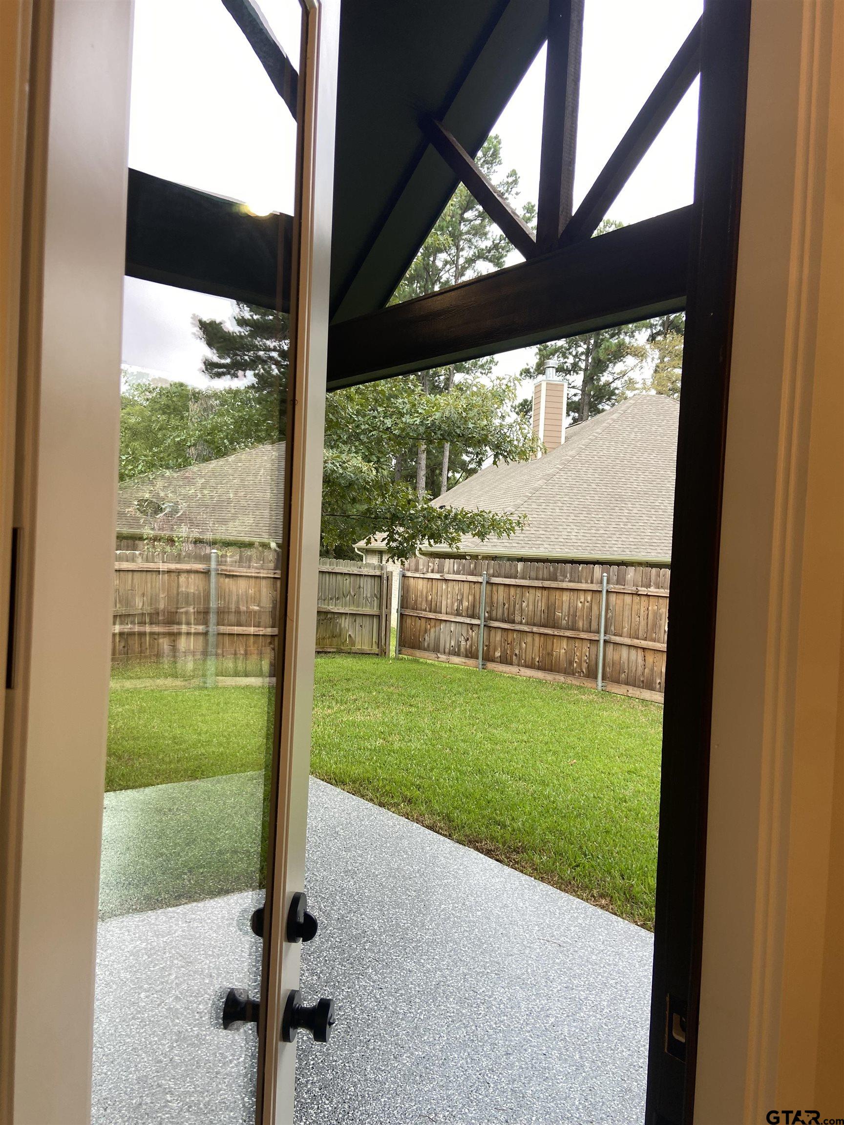 18690 Windjammer Place Flint, TX 75762 - Photo 44 of 47 a view of a yard with a porch