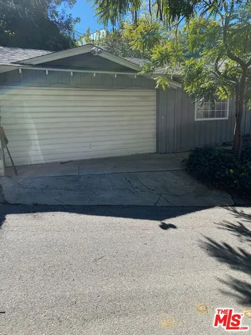 a view of backyard of a house