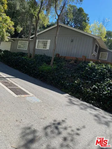 a view of bushes and pathway