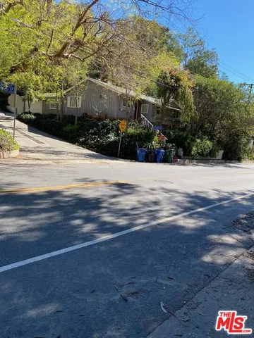 a picture of street with view of trees