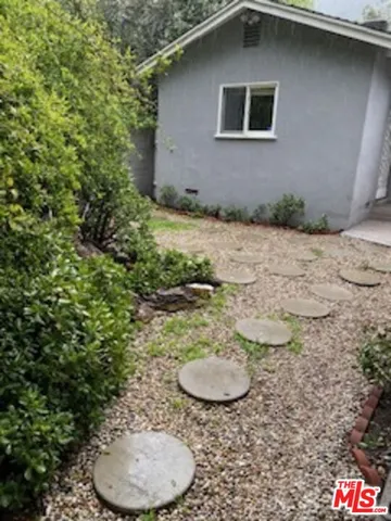 a backyard of a house with entertaining space