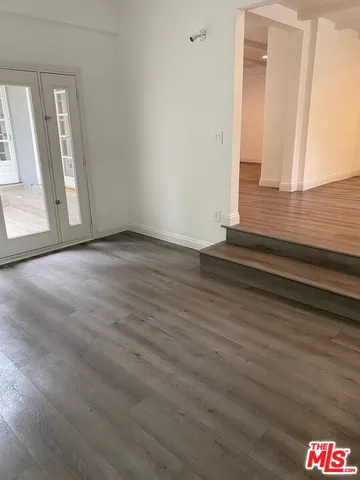 a view of an entryway with wooden floor