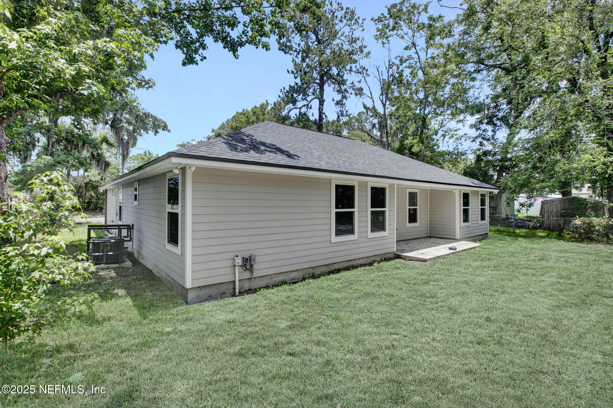 7442 Richardson Road Jacksonville, FL 32209 - Photo 15 of 15 a view of a house with a yard and large tree