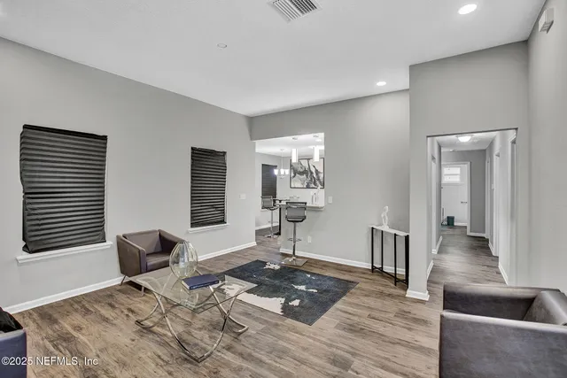 a living room with furniture and a window