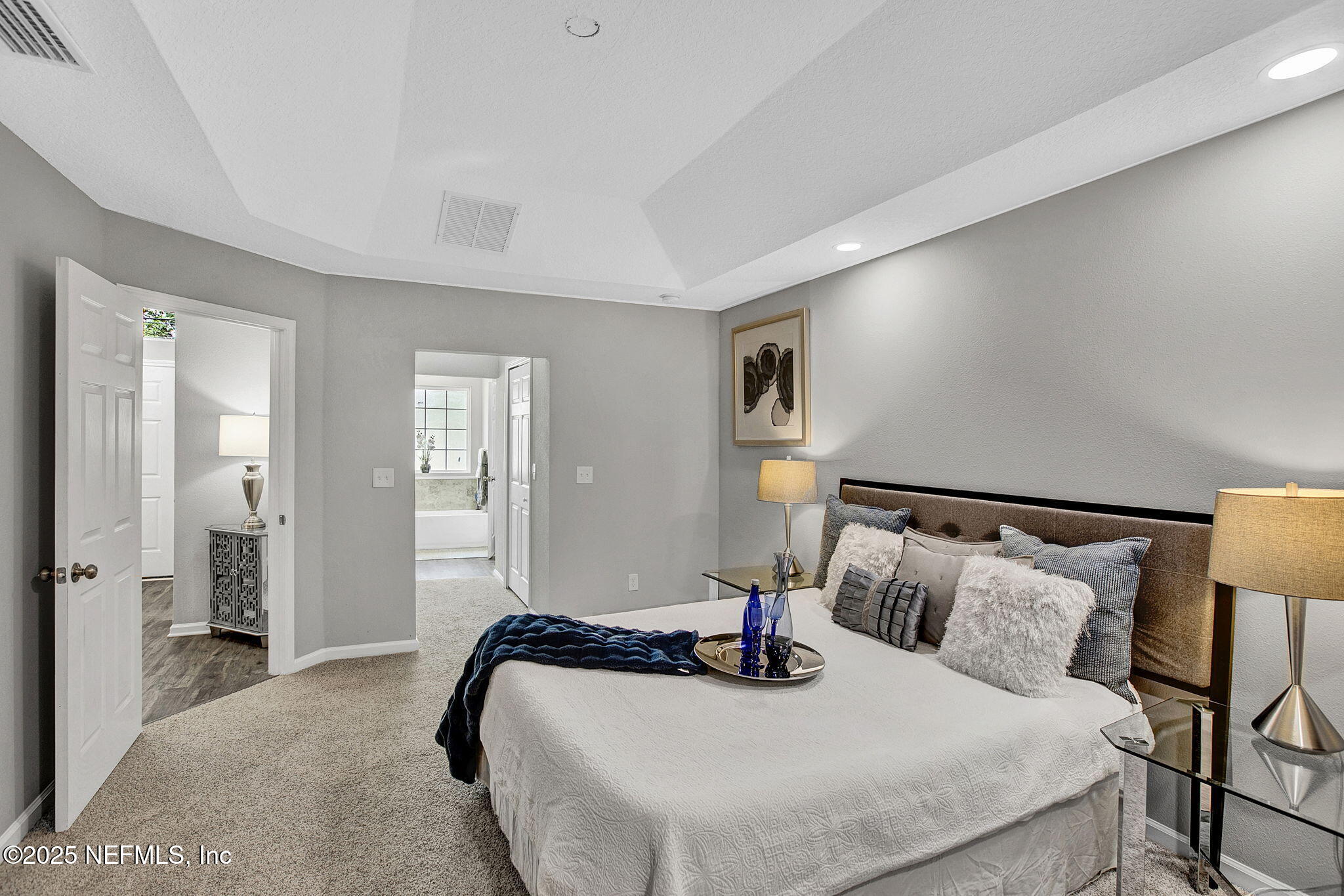 7442 Richardson Road Jacksonville, FL 32209 - Photo 10 of 15 a bedroom with a bed and wooden floor