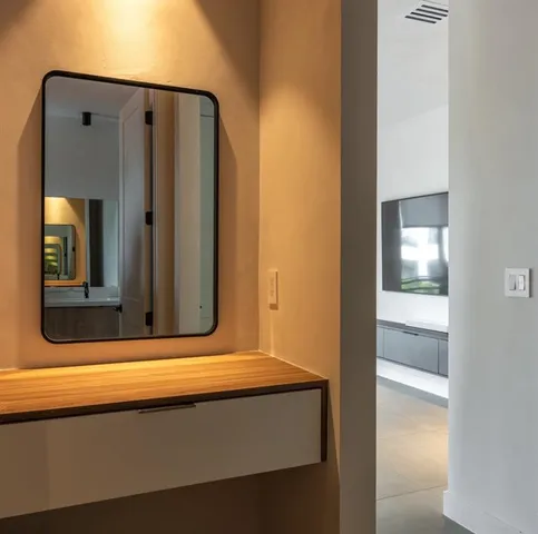 a bathroom with a bathtub and a mirror