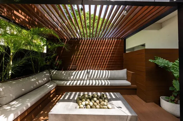a front view of a house with a potted plant