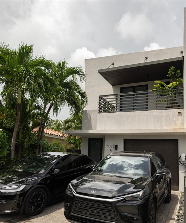 1635 Southwest 19th Terrace Miami, FL 33145 - Photo 19 of 20 a car parked in front of a house
