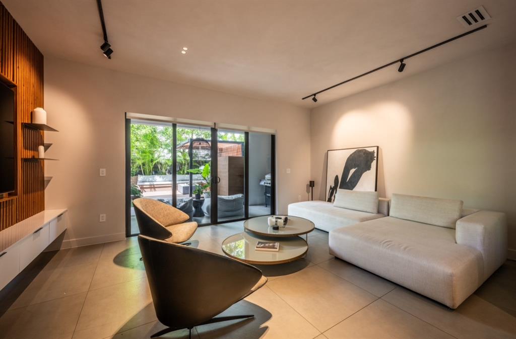 1635 Southwest 19th Terrace Miami, FL 33145 - Photo 6 of 20 a living room with furniture and a flat screen tv