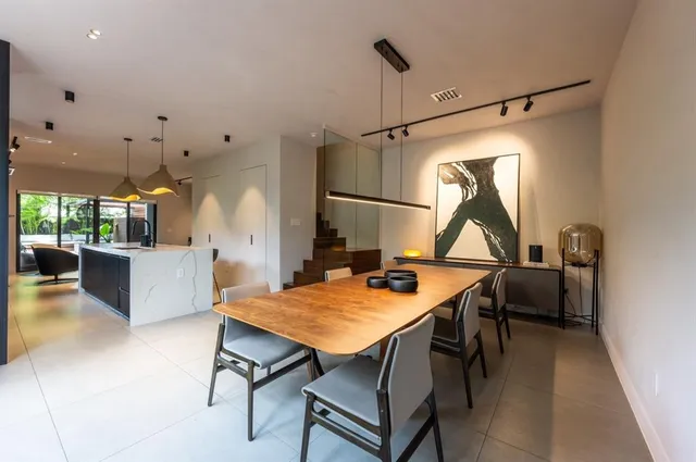 a view of a dining room and a table and chairs