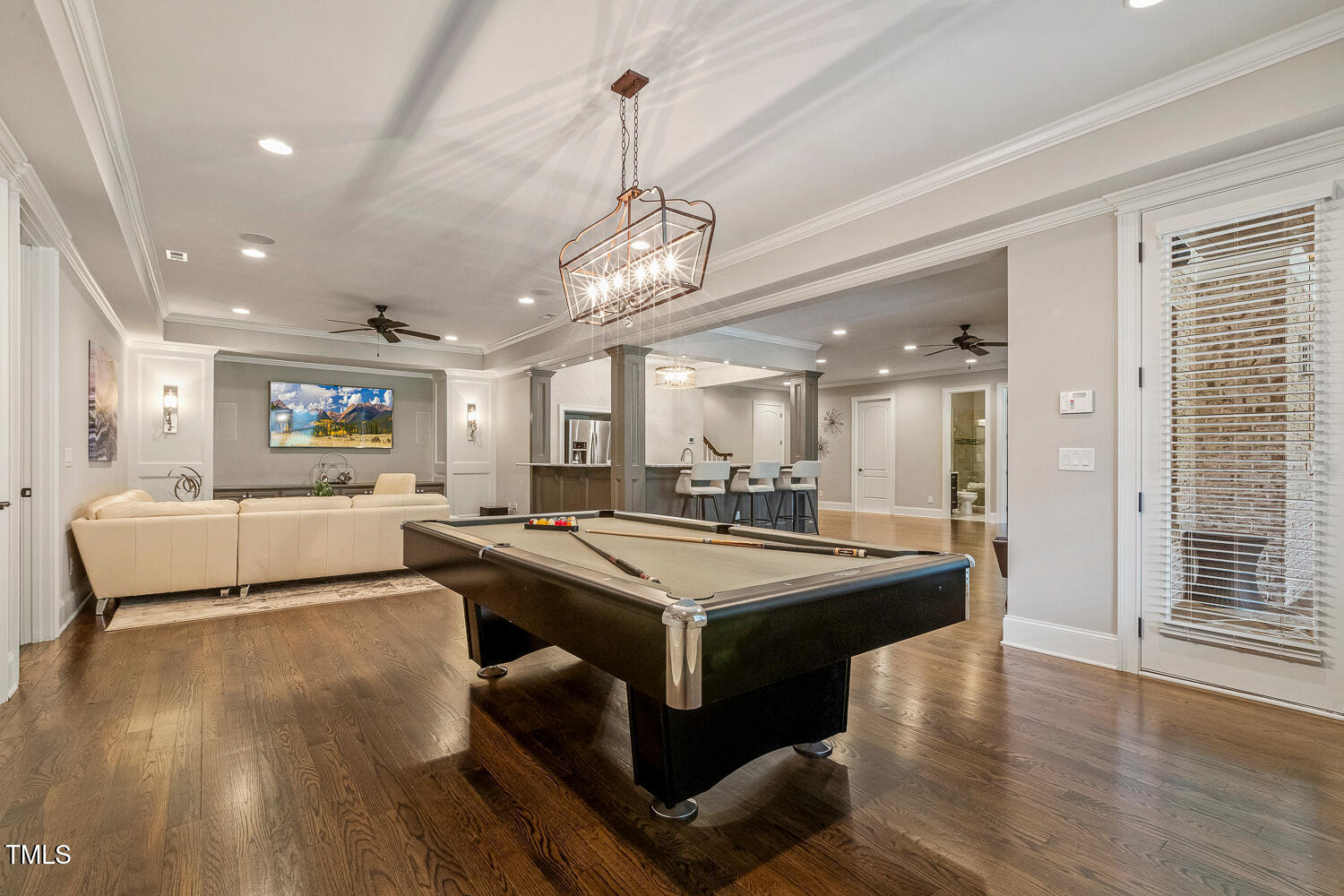 1205 Queensferry Road Cary, NC 27511 - Photo 39 of 63 a dining hall with stainless steel appliances granite countertop a sink dishwasher and a dining table with wooden floor