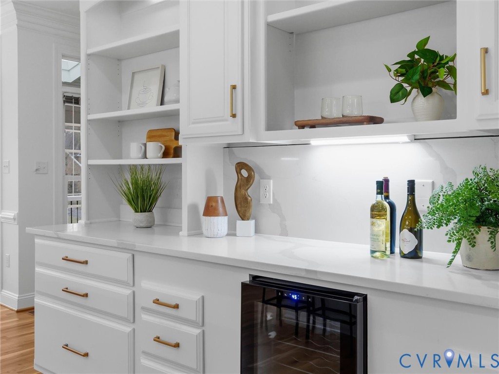14335 Lander Road Midlothian, VA 23113 - Photo 20 of 70 a kitchen with a potted plant on the counter and cabinets