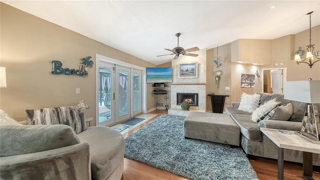 5968 Rachele Drive Sarasota, FL 34243 - Photo 11 of 55 a living room with furniture and a fireplace