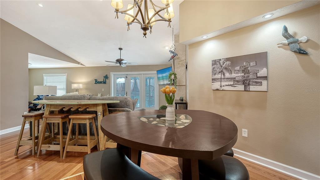 5968 Rachele Drive Sarasota, FL 34243 - Photo 14 of 55 a view of a dining room with furniture and wooden floor