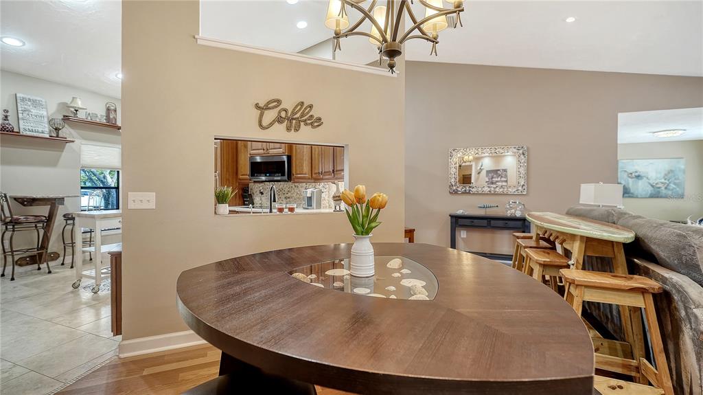 5968 Rachele Drive Sarasota, FL 34243 - Photo 17 of 55 a dining room with furniture and wooden floor