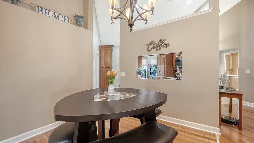 5968 Rachele Drive Sarasota, FL 34243 - Photo 18 of 55 a view of a dining room with furniture and wooden floor