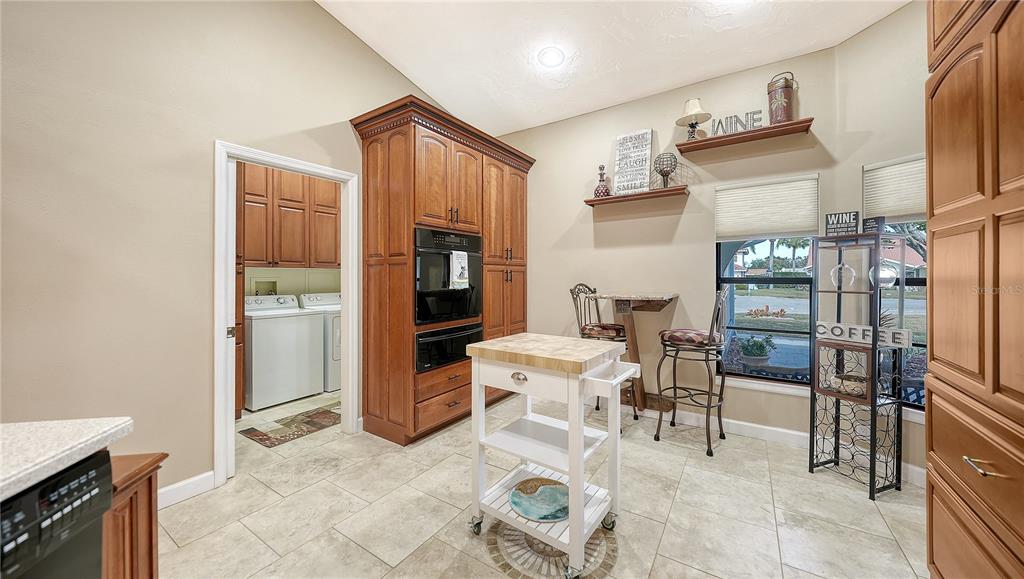 5968 Rachele Drive Sarasota, FL 34243 - Photo 23 of 55 a living room with furniture a rug and white walls
