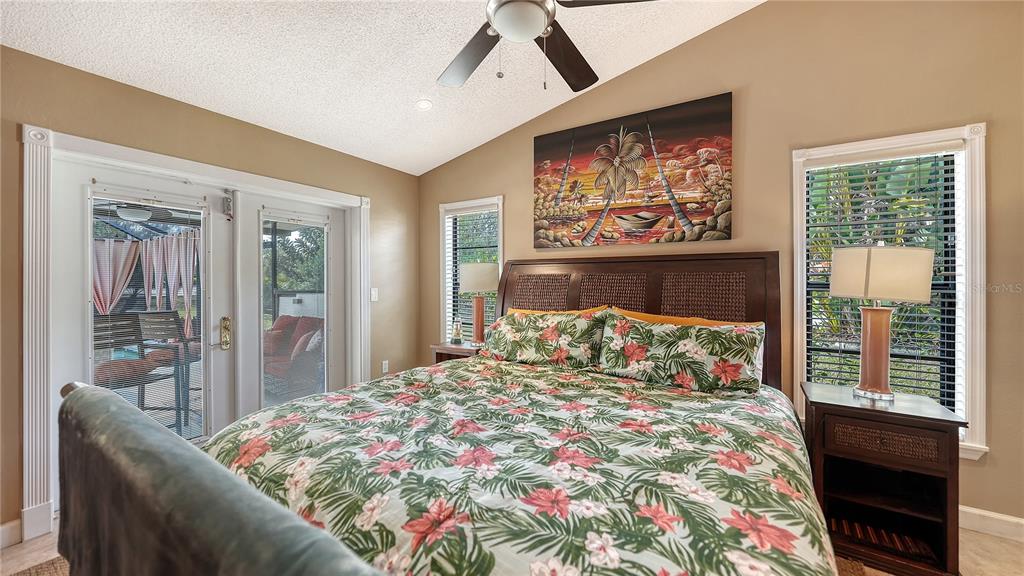 5968 Rachele Drive Sarasota, FL 34243 - Photo 25 of 55 a bedroom with a large bed and a window