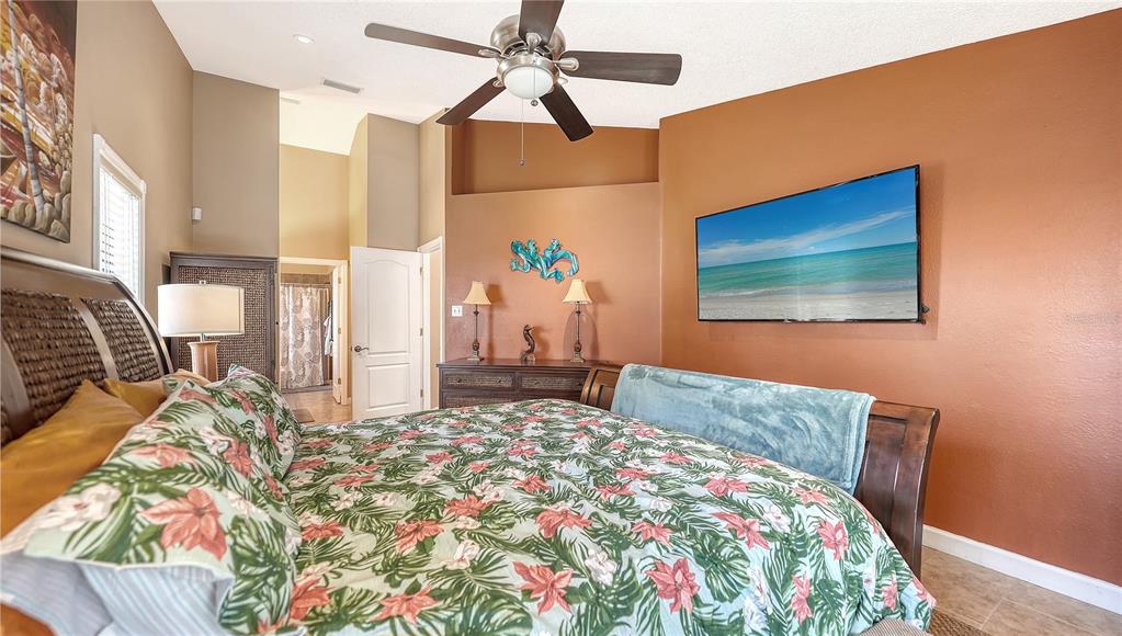 5968 Rachele Drive Sarasota, FL 34243 - Photo 27 of 55 a bed sitting in a bedroom next to a window