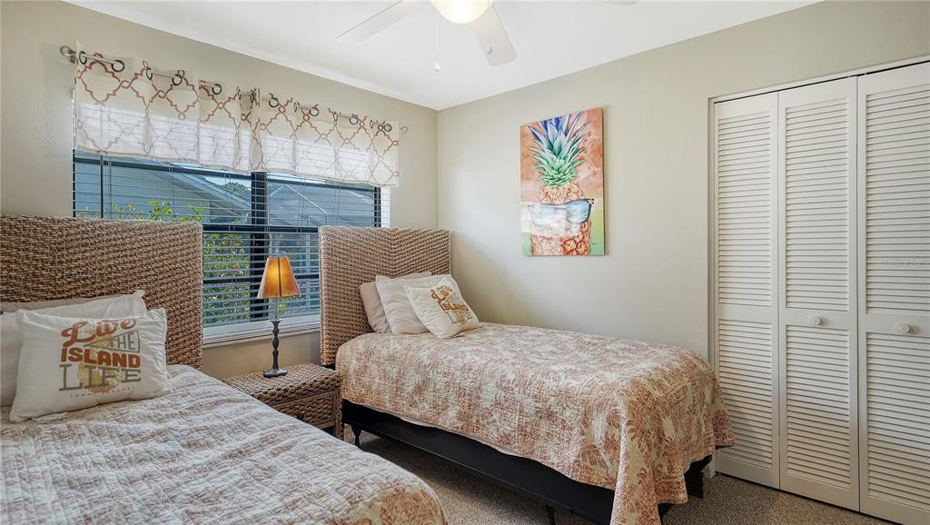 5968 Rachele Drive Sarasota, FL 34243 - Photo 35 of 55 a bedroom with a bed and a window