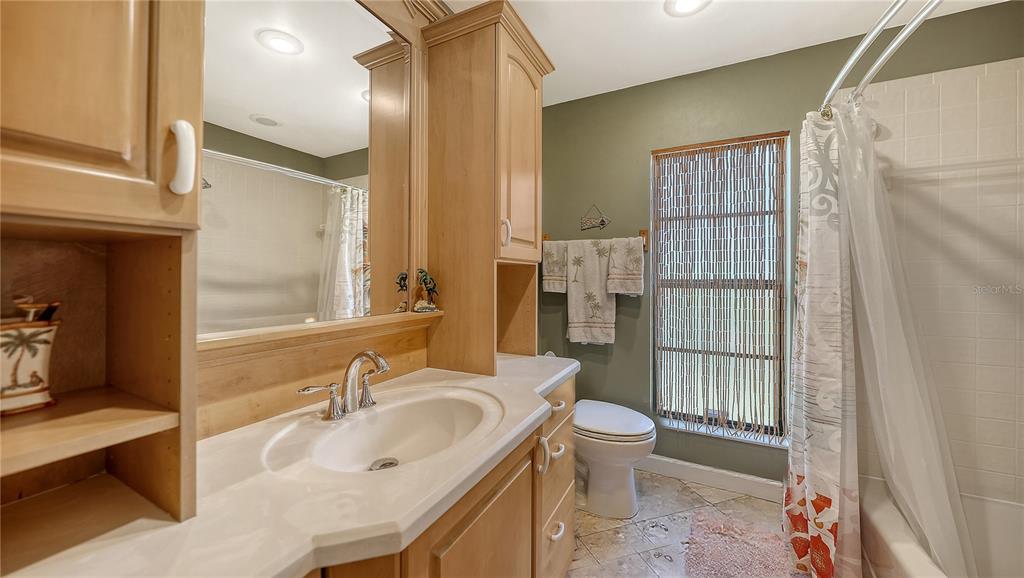5968 Rachele Drive Sarasota, FL 34243 - Photo 38 of 55 a bathroom with a sink toilet and shower