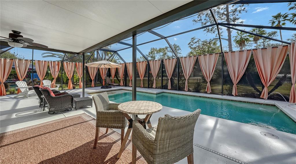 5968 Rachele Drive Sarasota, FL 34243 - Photo 51 of 55 a patio with a yard table and chairs