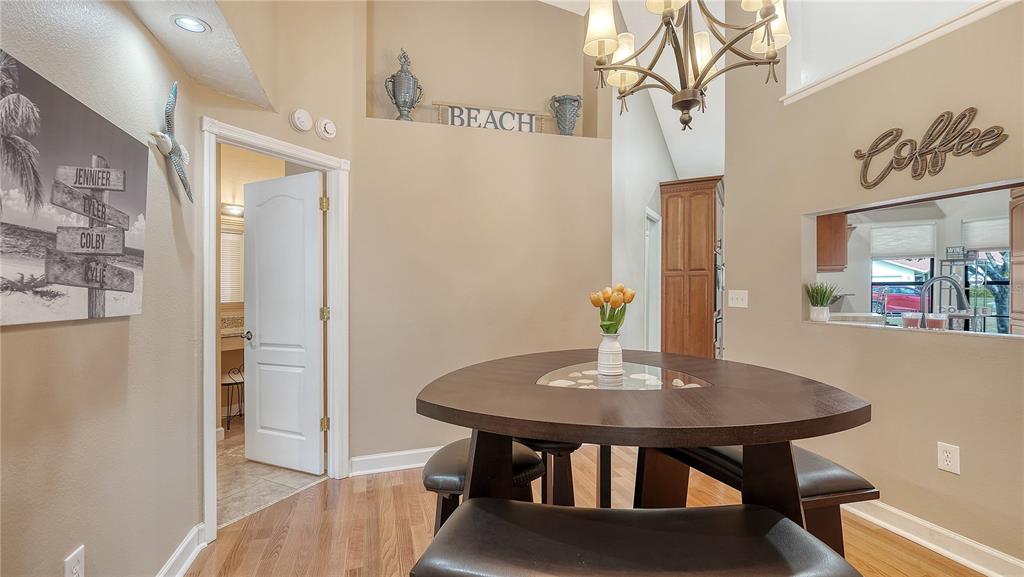 5968 Rachele Drive Sarasota, FL 34243 - Photo 55 of 55 a view of a dining room with furniture and wooden floor
