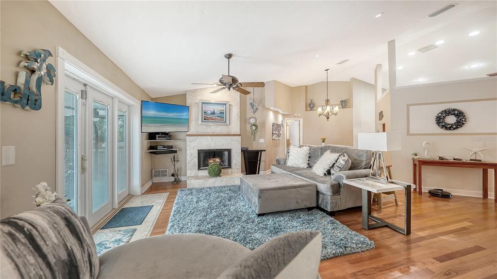 5968 Rachele Drive Sarasota, FL 34243 - Photo 7 of 55 a living room with furniture and a fireplace