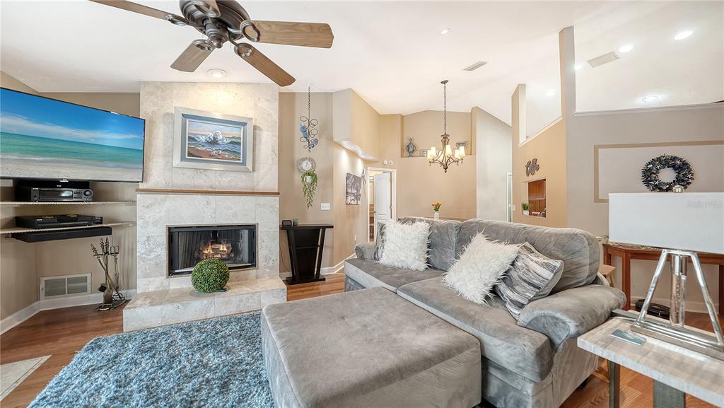 5968 Rachele Drive Sarasota, FL 34243 - Photo 8 of 55 a living room with furniture and a fireplace