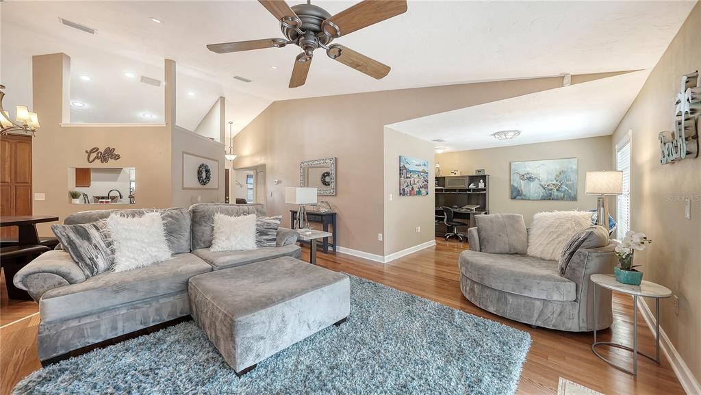 5968 Rachele Drive Sarasota, FL 34243 - Photo 9 of 55 a living room with furniture and a view of kitchen