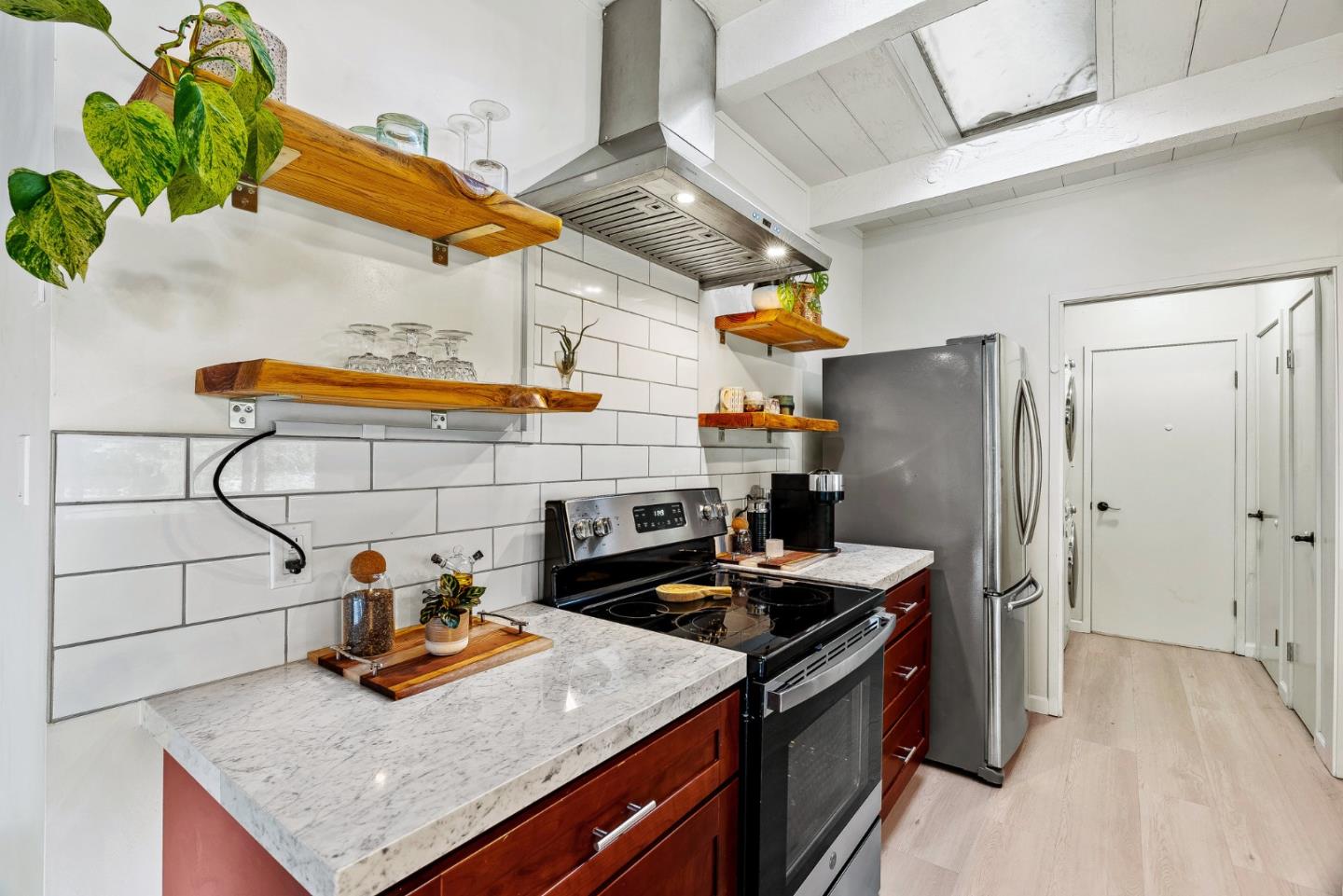 4900 Trout Gulch Road Aptos, CA 95003 - Photo 13 of 33 a kitchen with stainless steel appliances granite countertop a sink a stove and a refrigerator