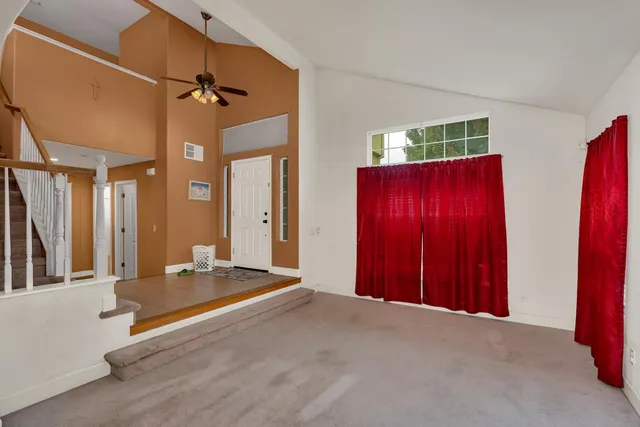 a kitchen with stainless steel appliances granite countertop a sink refrigerator and cabinets