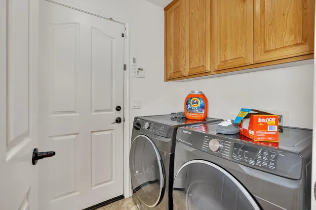 a view of an empty room with a fireplace