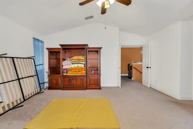 a bedroom with a bed and dresser