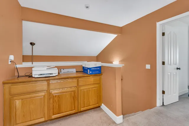 a bedroom with furniture and window