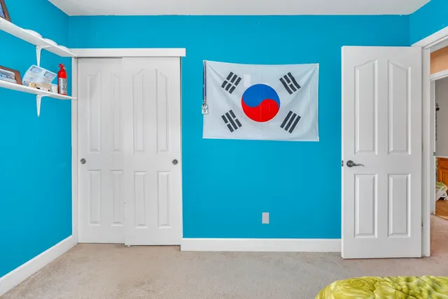 a view of a patio with couches and table and chairs and potted plants