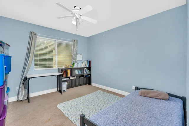 a view of a house with backyard and porch