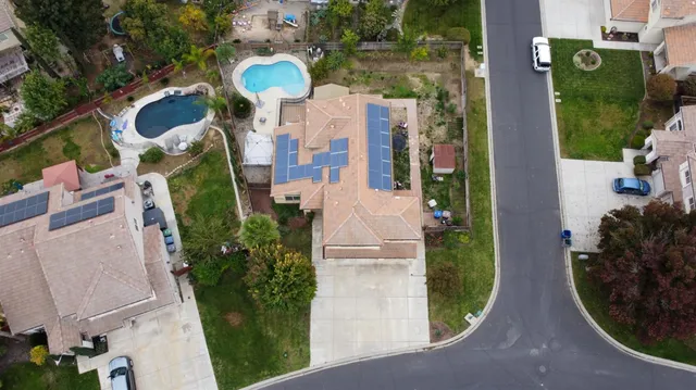 an aerial view of residential houses with outdoor space