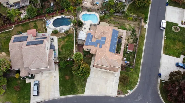an aerial view of residential houses with outdoor space