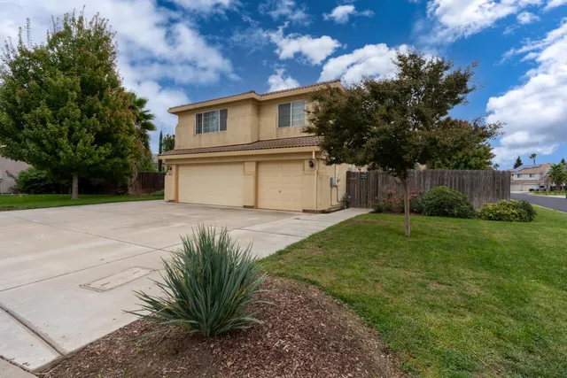a house with a tree in front of it