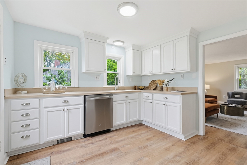 24 Otis Road Barnstable, MA 02601 - Photo 6 of 33 a kitchen with granite countertop a sink stainless steel appliances and window