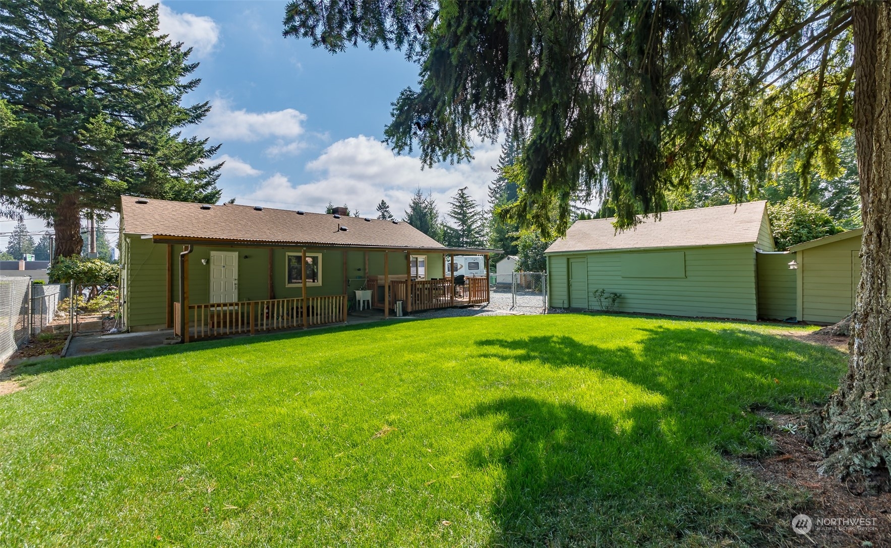 6930 East Cady Road Everett, WA 98203 - Photo 17 of 22 a front view of a house with a garden and yard