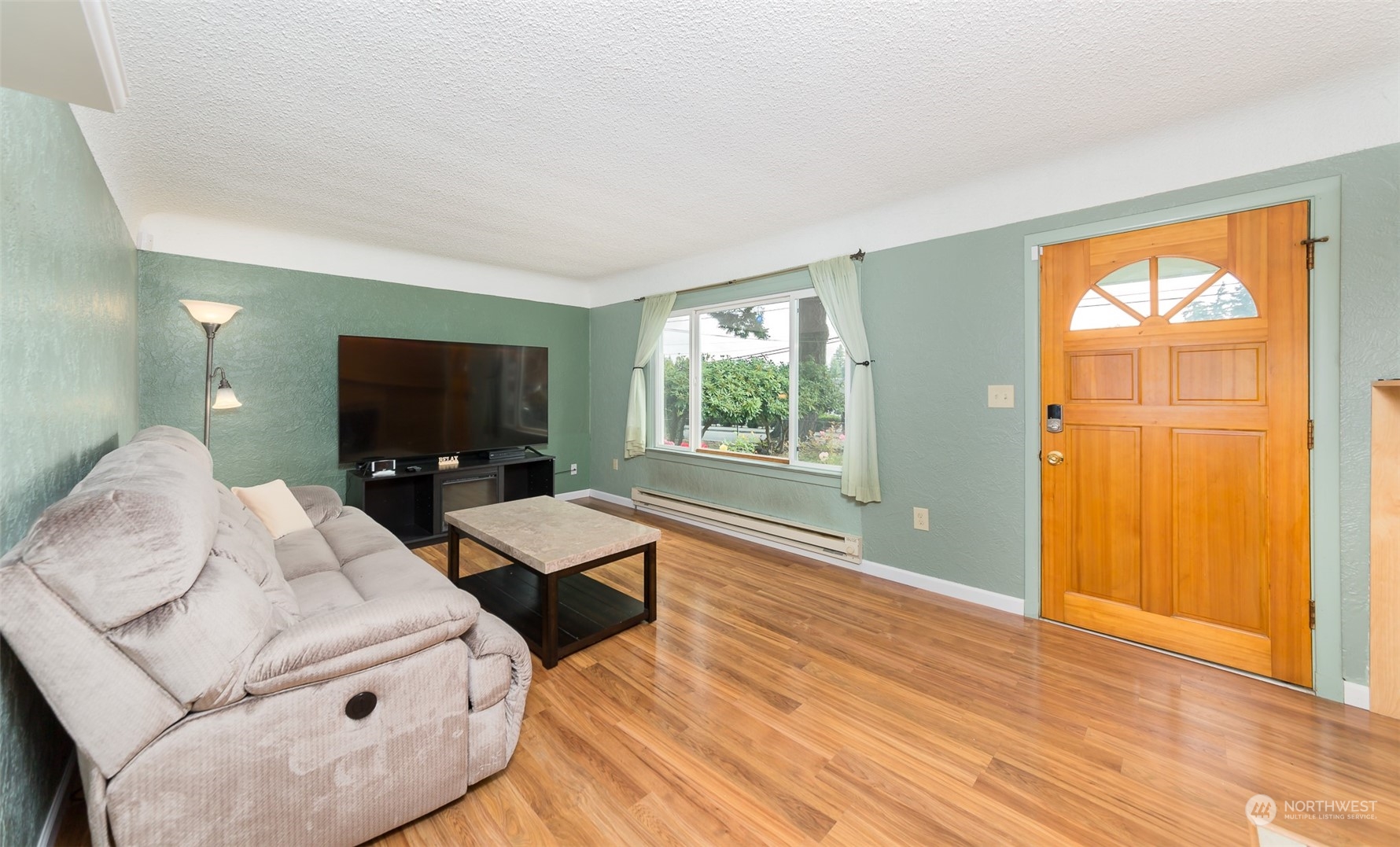 6930 East Cady Road Everett, WA 98203 - Photo 3 of 22 a living room with furniture and a flat screen tv
